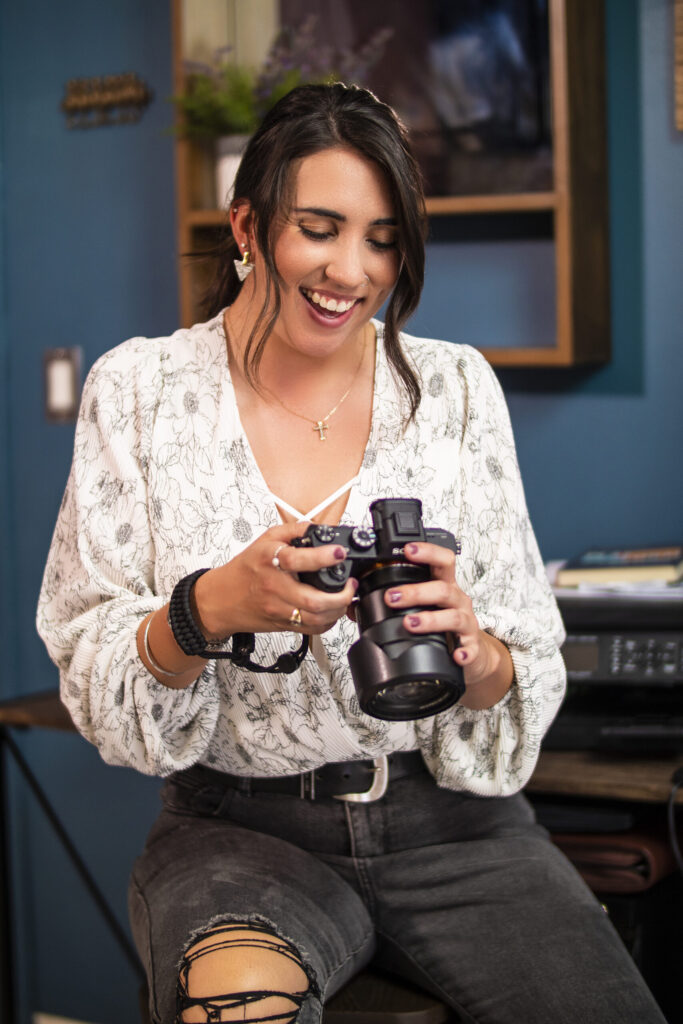 P2730806 Content Creation Services - Photo is of a woman looking excited while previewing a photo on her camera